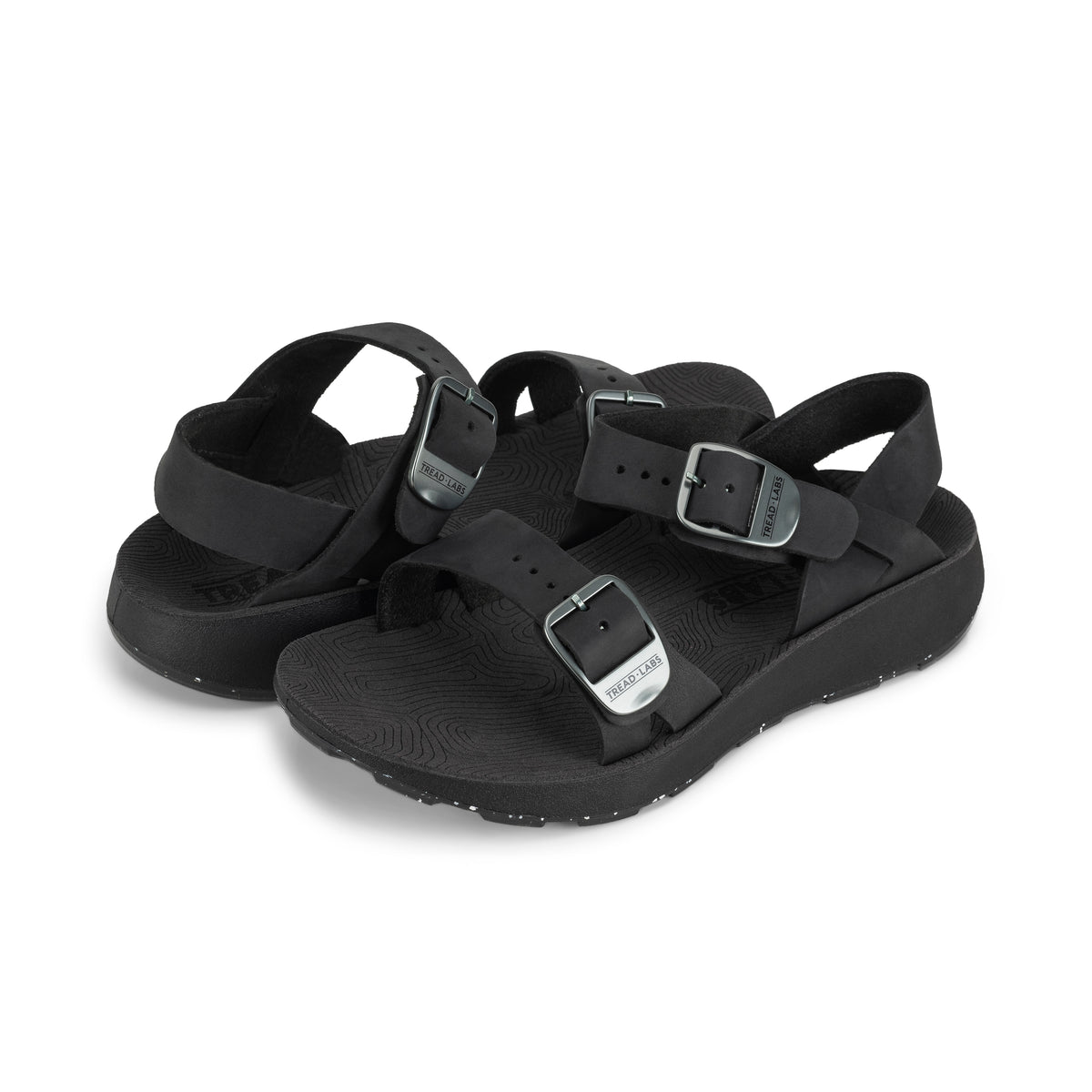 Pair of Women's Salinas Leather Sandals in Black on a white background.