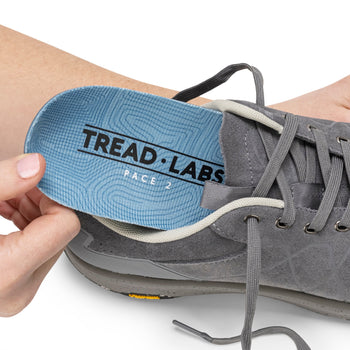 An insole entering a shoe