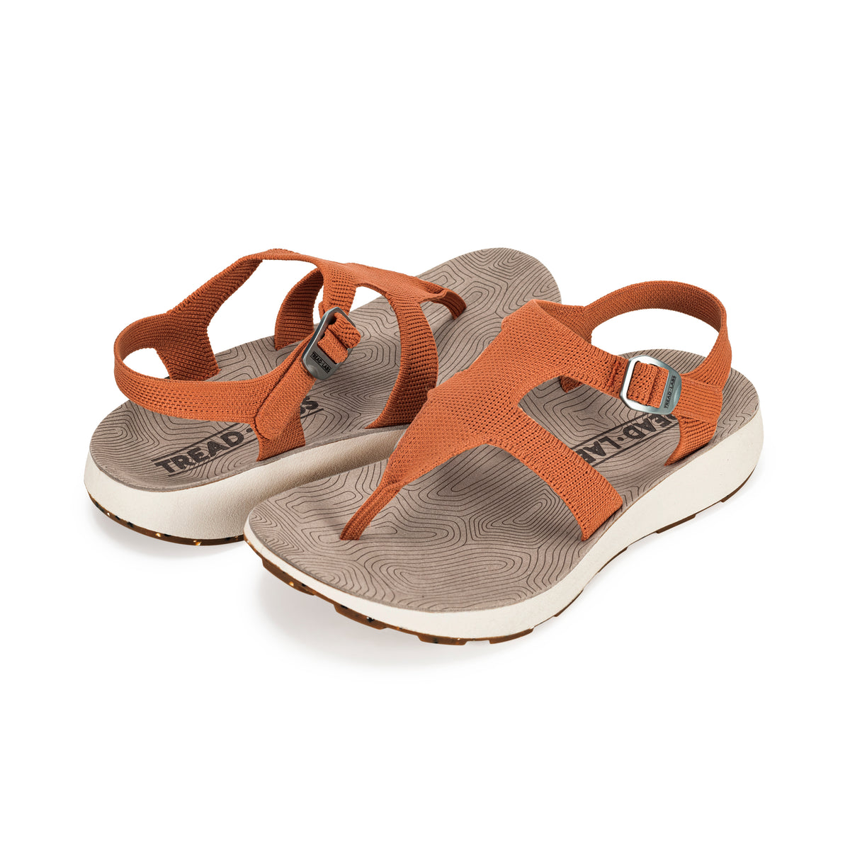 Pair of Women's Albion Sandals in Apricot on a white background.